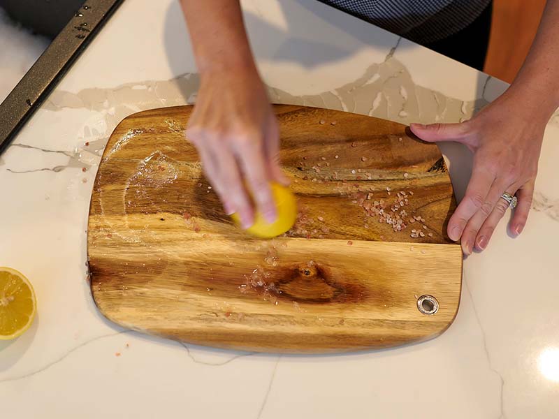 Cleaning a wood cutting board with lemon & salt